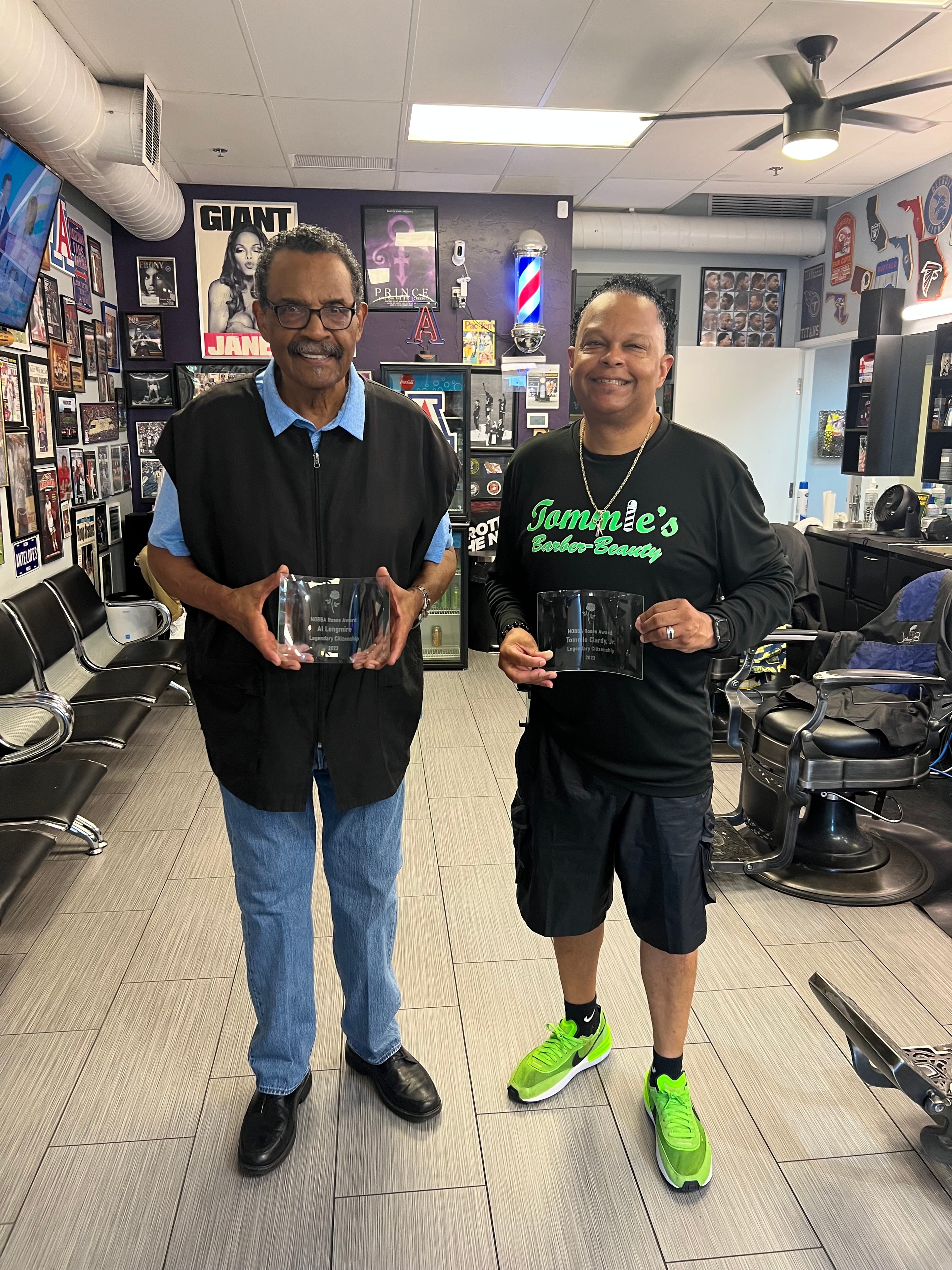 Award presentation at Tommie's Barber-Beauty