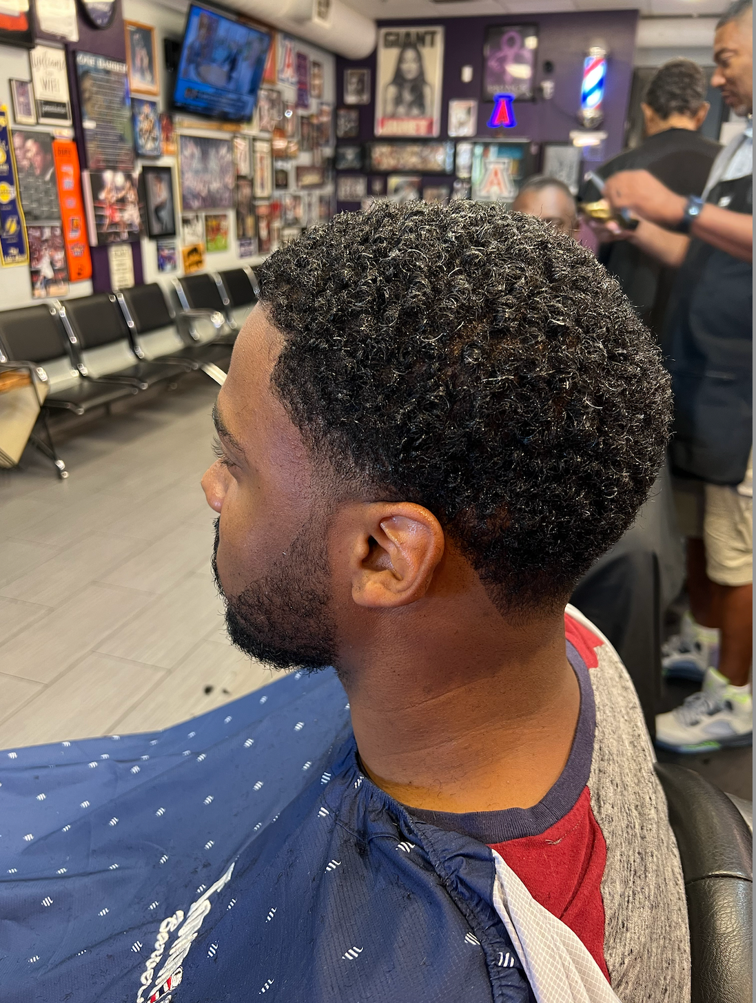 Curly temp fade haircut at Tommie's Barber-Beauty