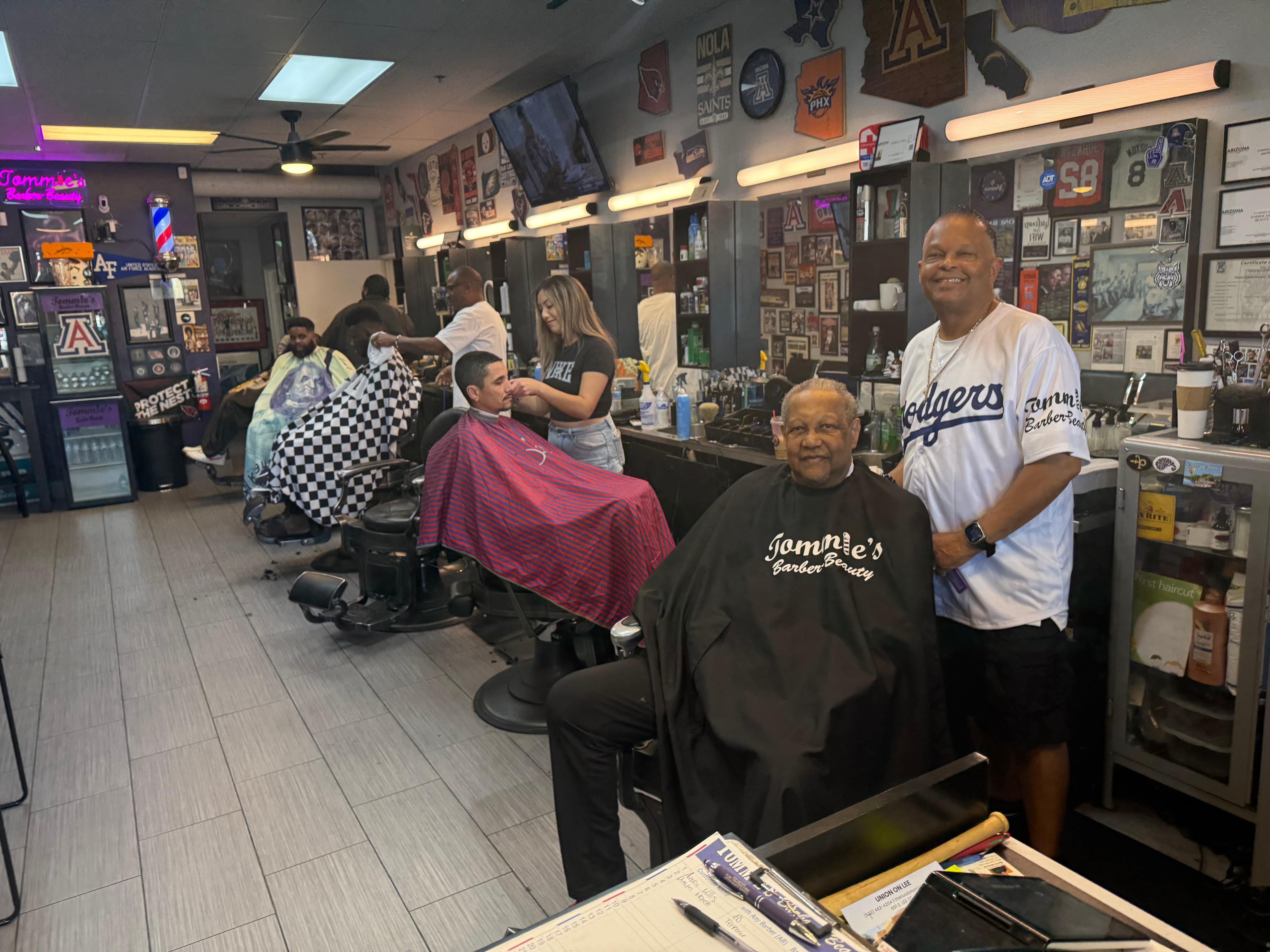 Busy interior of Tommie's Barber-Beauty shop