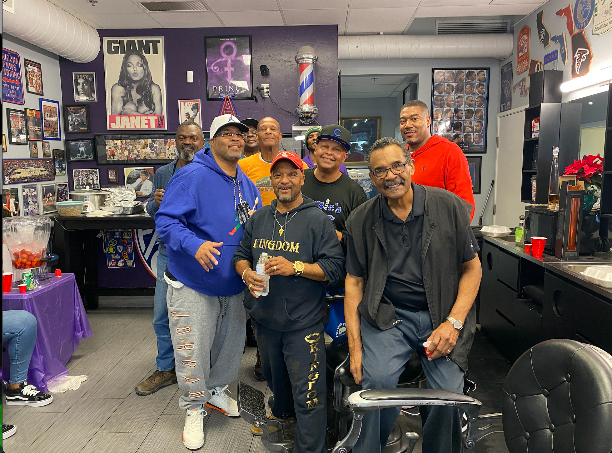Group of customers and friends gathered at Tommie's Barber-Beauty