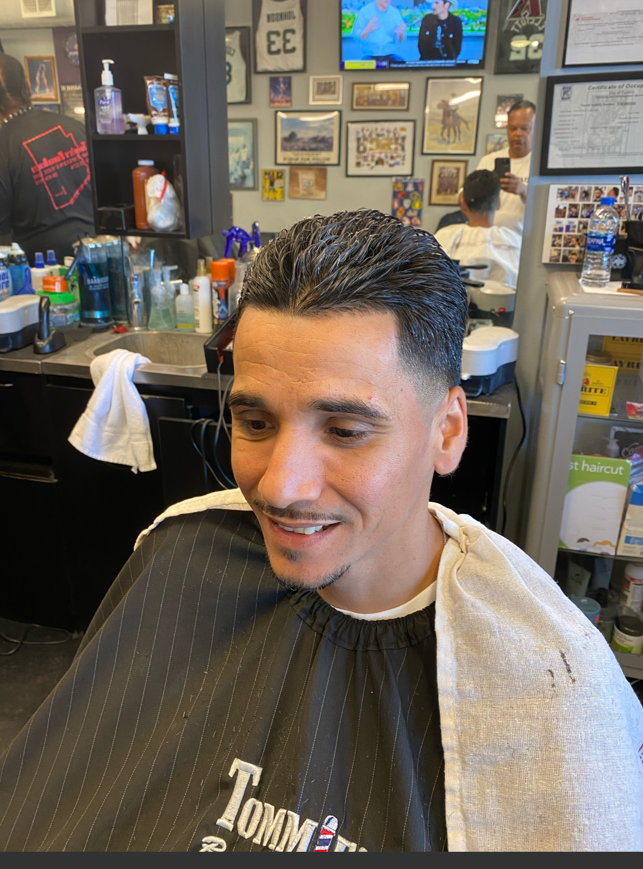 Taper fade with comb over at Tommie's Barber-Beauty