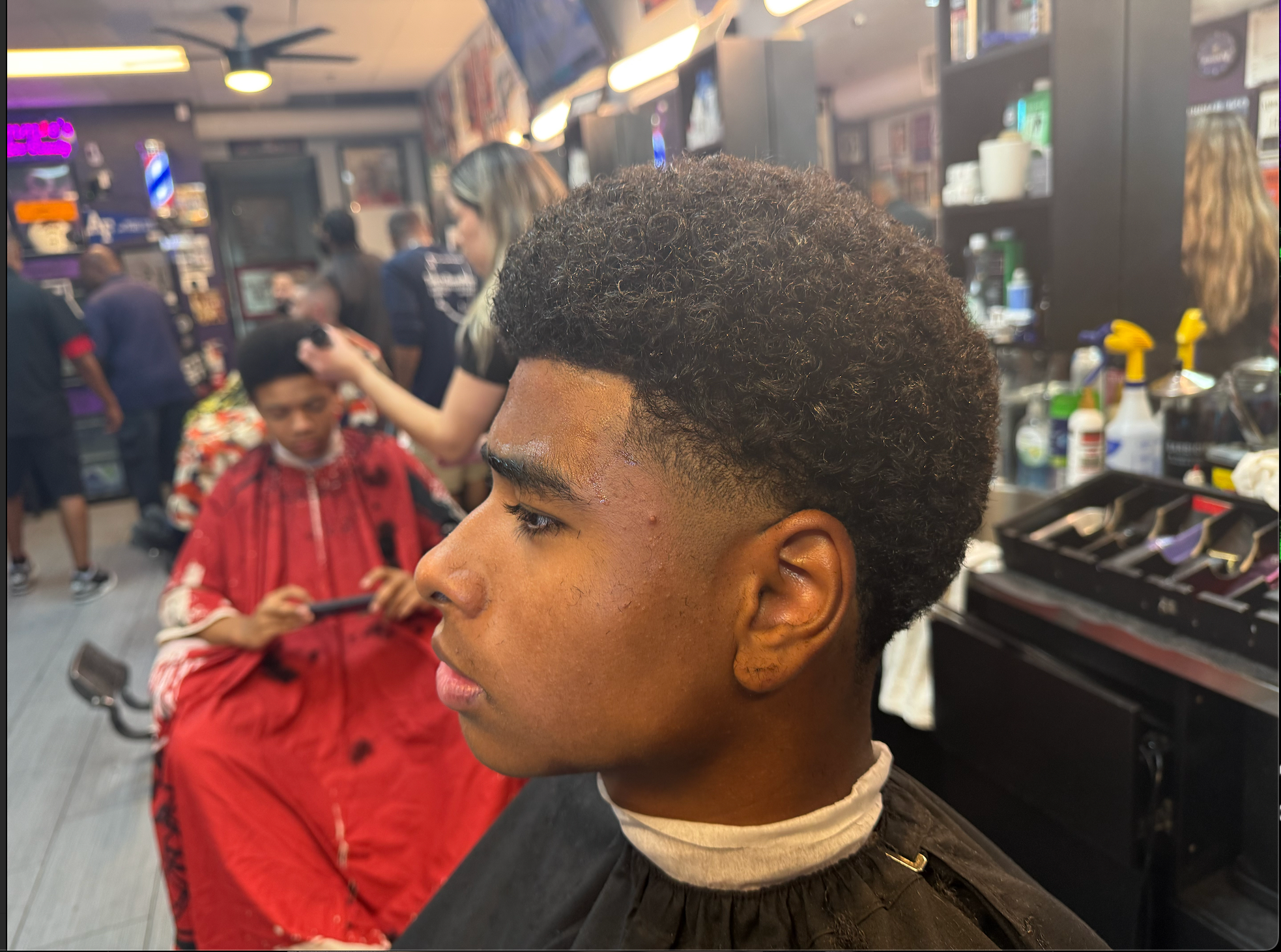 Youth fade haircut at Tommie's Barber-Beauty